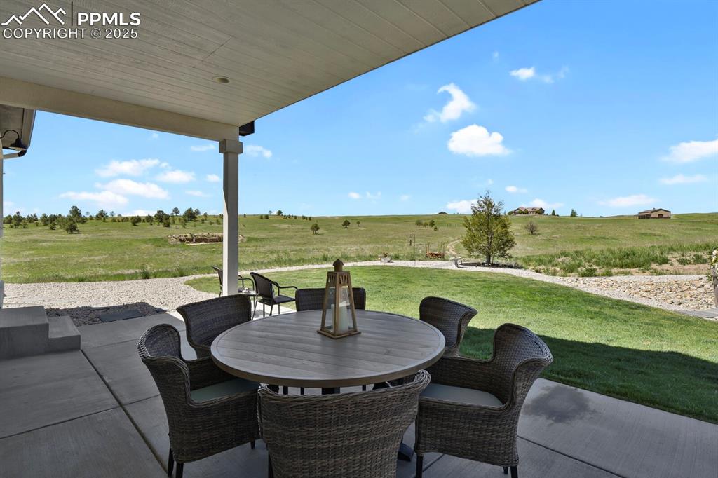Image 36 of 49: View of covered patio / terrace with a rural view