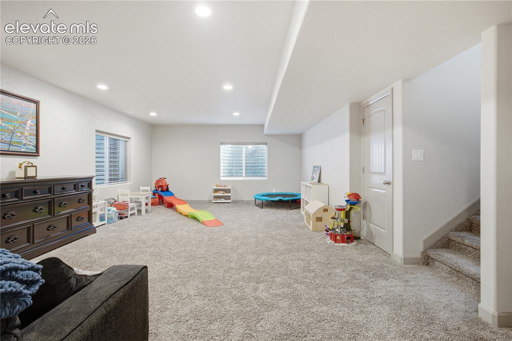 Image 25 of 40: Lower level family/play room