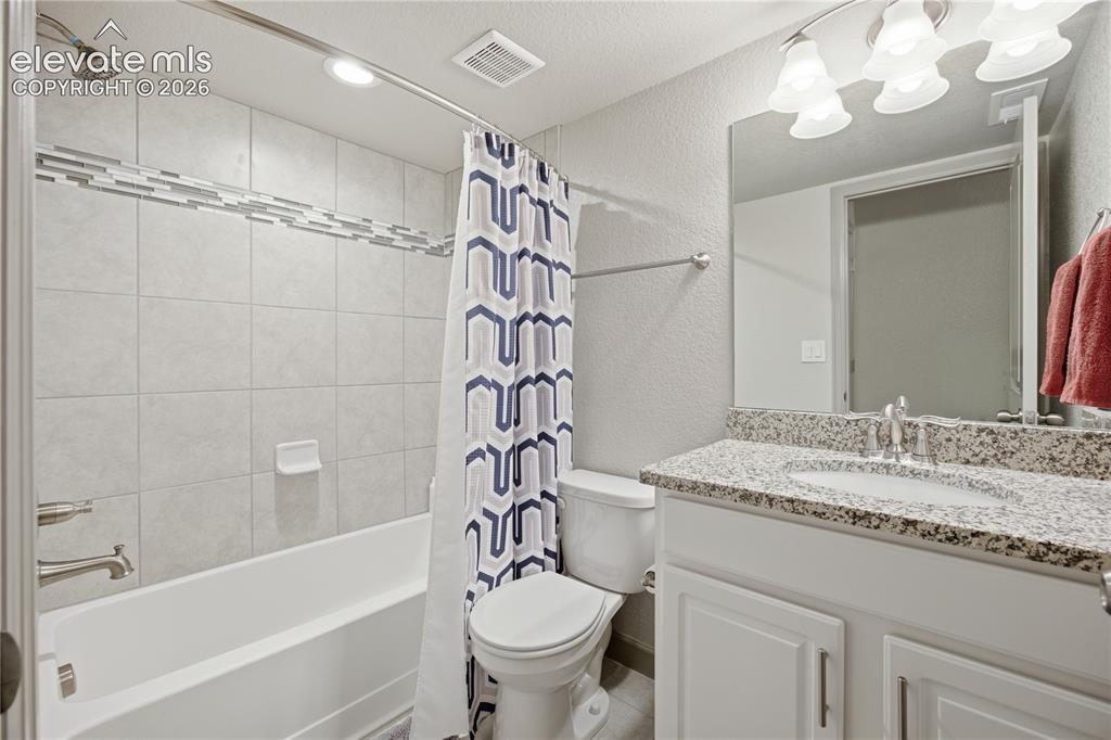 Image 27 of 40: Lower level full bath