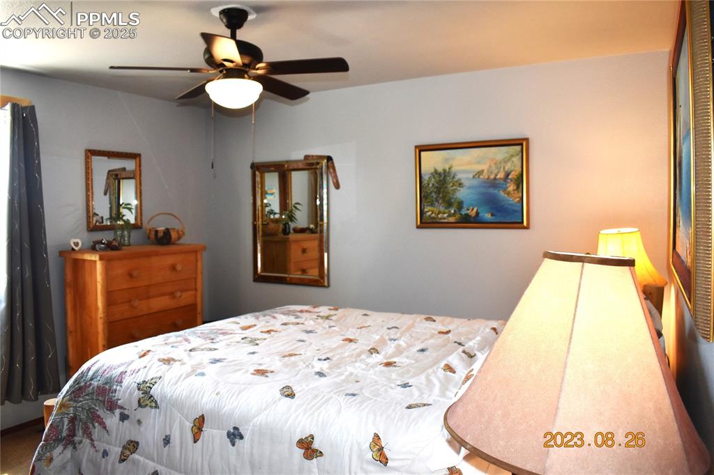 Image 11 of 48: Up stairs bedroom with newer ceiling fan.