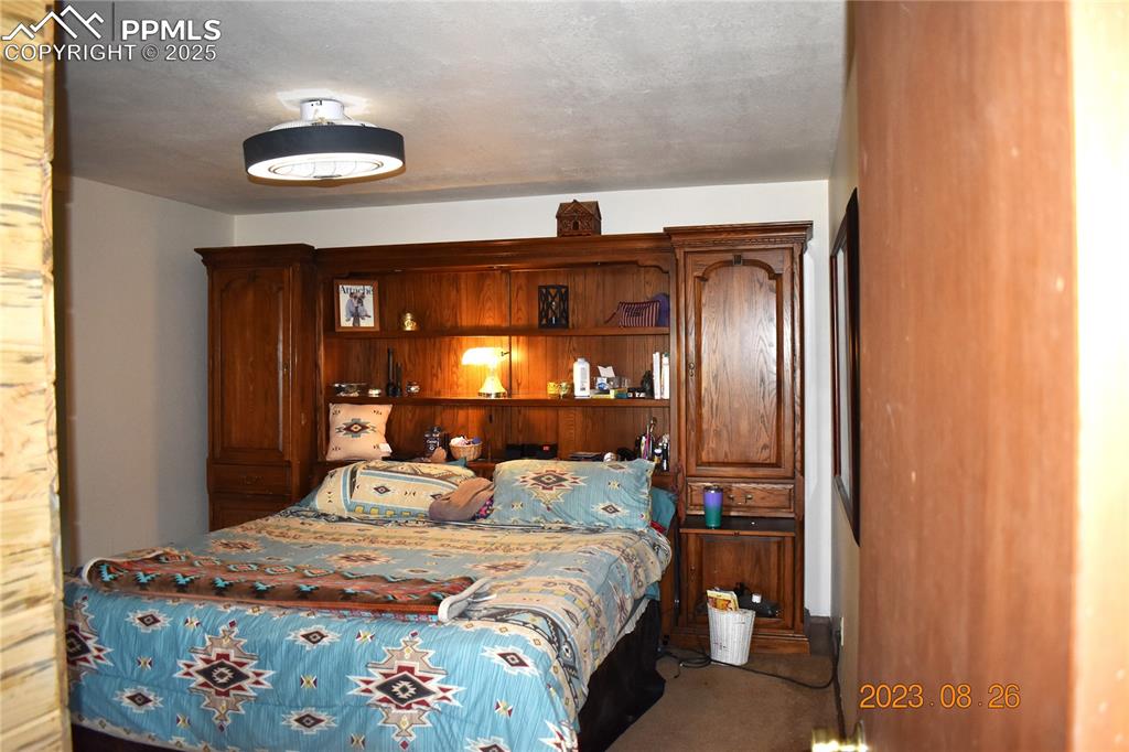 Image 14 of 48: View of half of master bedroom.  