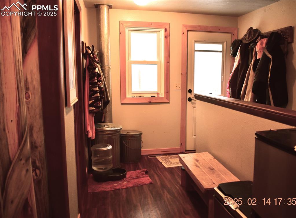 Image 21 of 48: Entryway with hardwood / wood-style flooring
