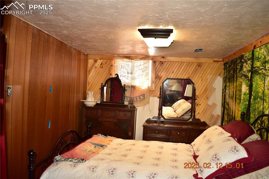 Image 23 of 48: Unconventional bedroom, has moveable wall and no closet, but the area on th