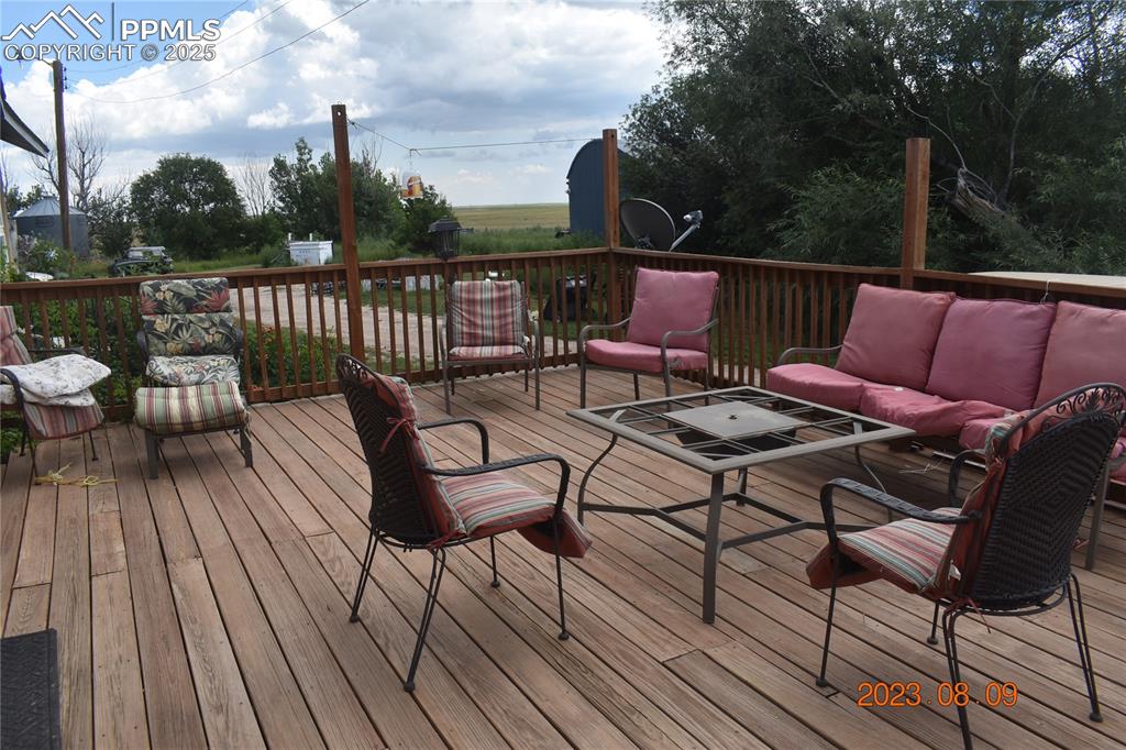 Image 30 of 48: Large 24x16 deck on south side of the home. 