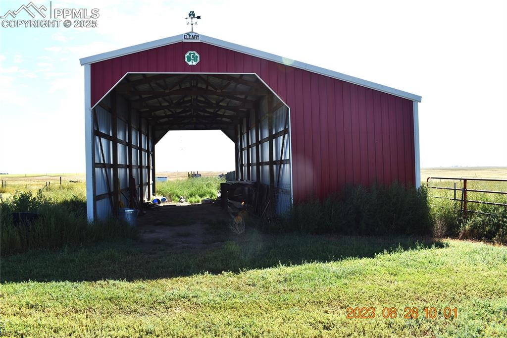 Image 34 of 48: Drive through Barn great for equipment or RV.  The right side of this barn 