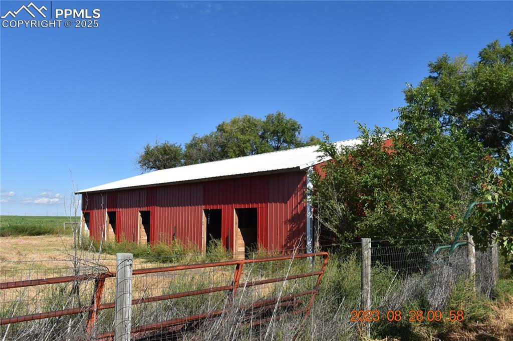 Image 38 of 48: Horse barn with five 12x12 stalls.  Not viewed here but includes 12 x12 tur