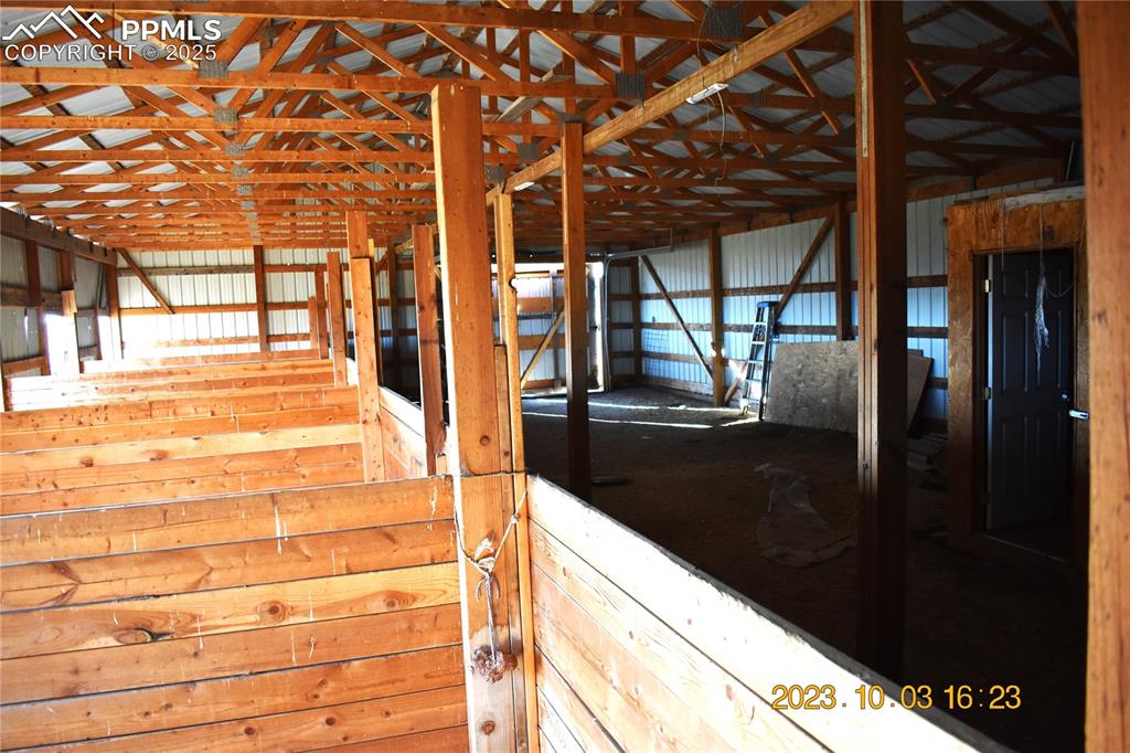 Image 40 of 48: View of horse stall /barn.