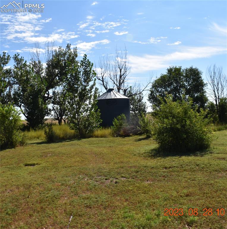 Image 43 of 48: One of two grain bins being used as equipment storage.