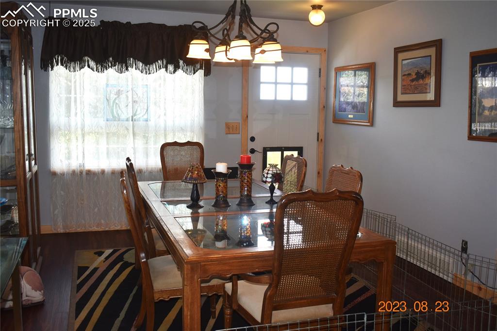 Image 7 of 48: Dining room with a notable chandelier
