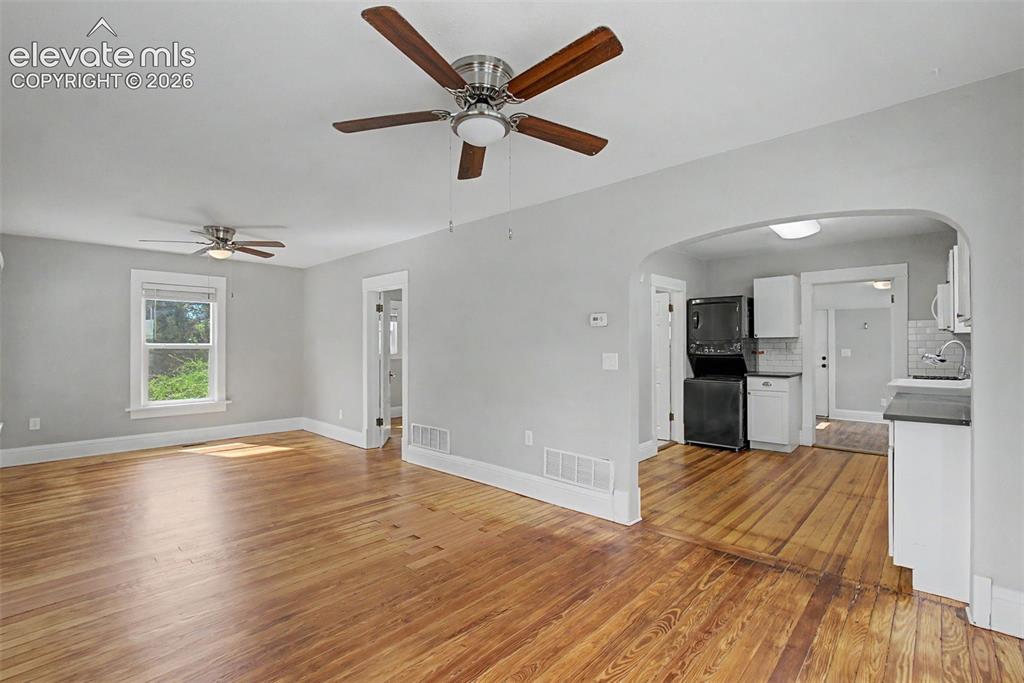 Image 10 of 20: Living room, and dining room, Douglas Fir solid wood floor