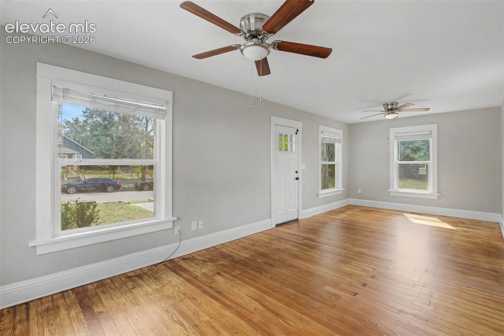 Image 11 of 20: Living room, and dining room, Douglas Fir solid wood floor