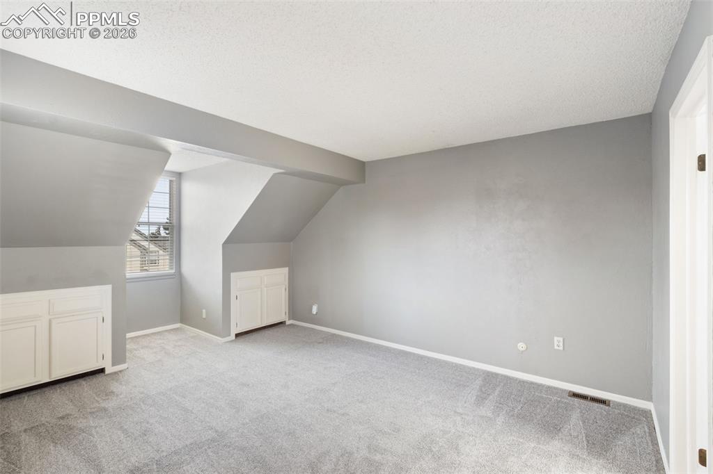Image 22 of 47: Primary Bedroom with adjoining bathroom and walk-in closet