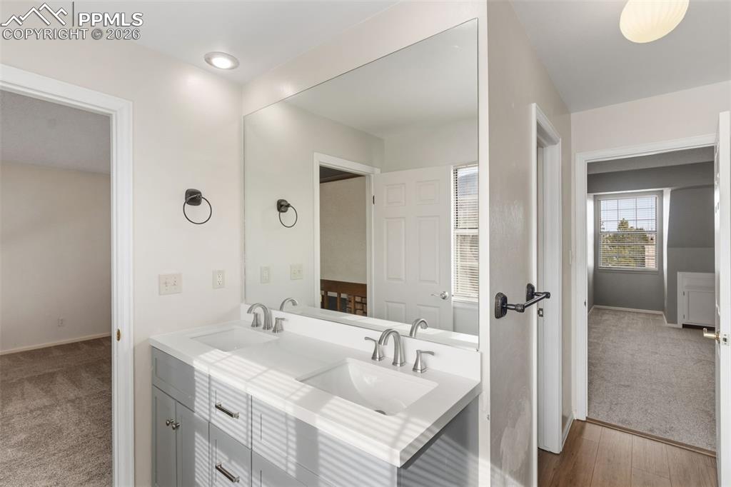 Image 26 of 47: Bathroom featuring double vanity and free-standing shower with barn door
