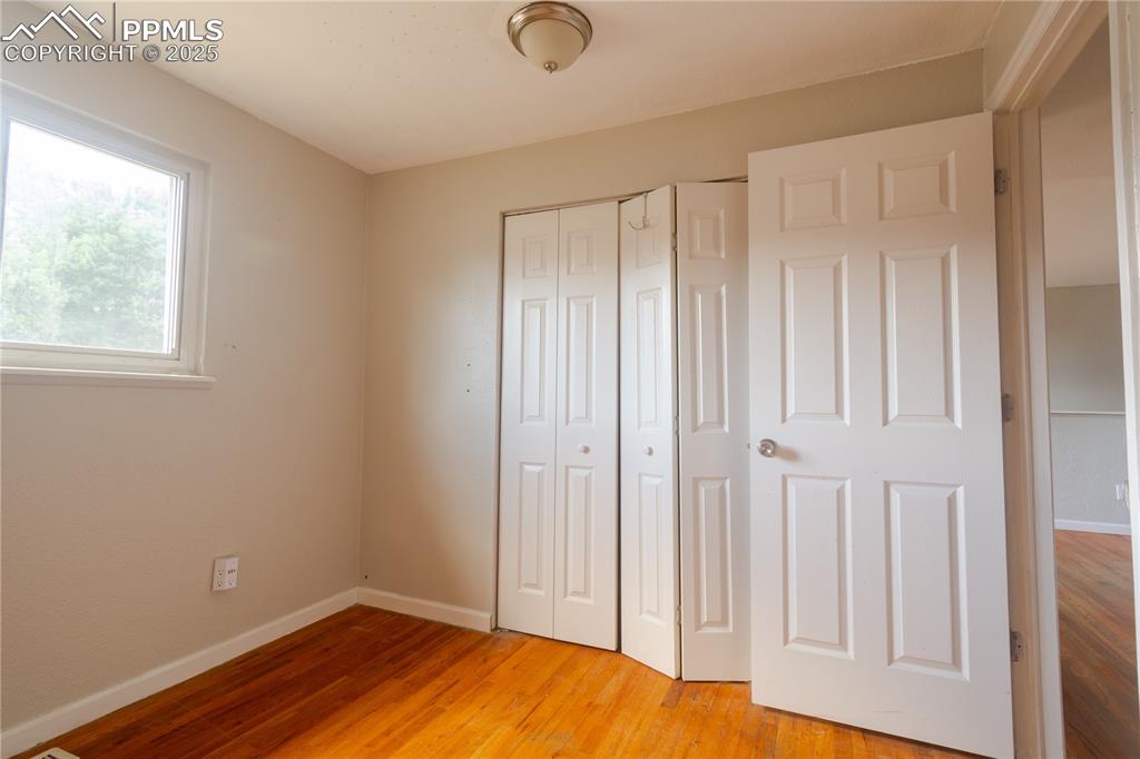 Image 14 of 44: Unfurnished bedroom featuring a closet and light wood-style floors