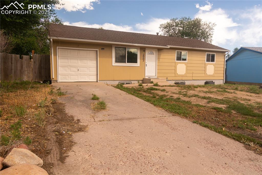 Image 2 of 44: Ranch-style house with concrete driveway, crawl space, a garage, and a shin