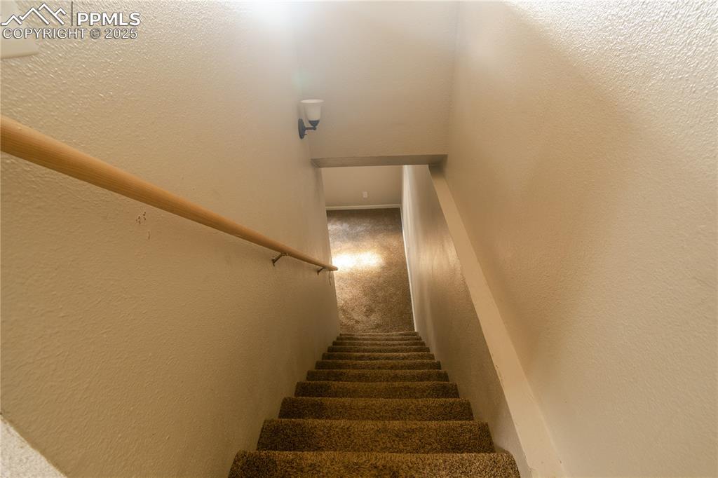 Image 29 of 44: Stairway with carpet