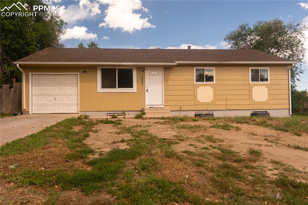 Image 3 of 44: View of front of house featuring a garage, driveway, crawl space, and a shi
