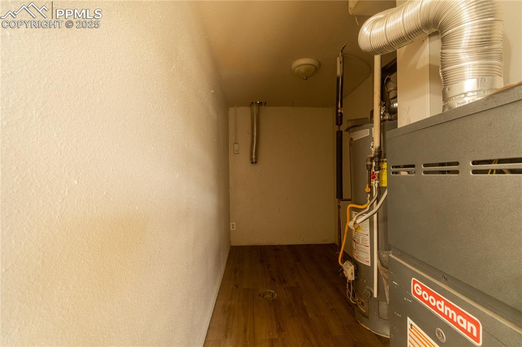 Image 33 of 44: Utilities featuring water heater and heating unit