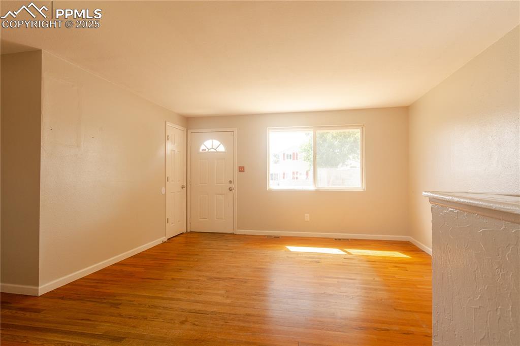 Image 7 of 44: Entryway with light wood-style flooring and baseboards