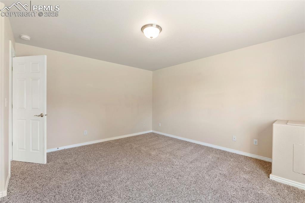 Image 31 of 50: Empty room featuring light carpet