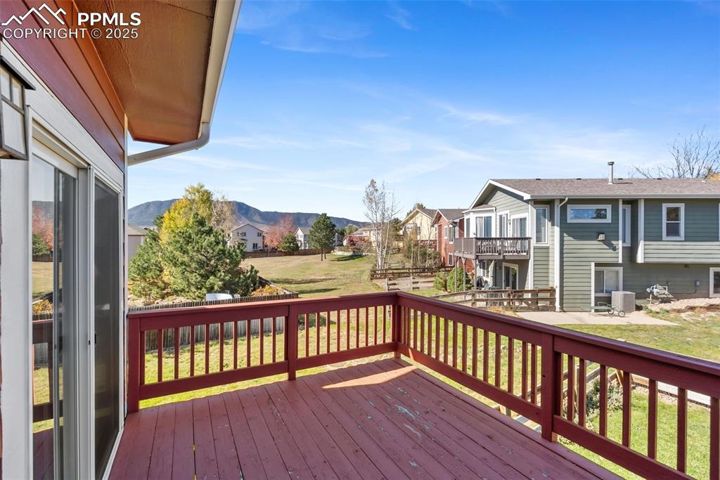 Image 36 of 50: Deck featuring a yard and a residential view