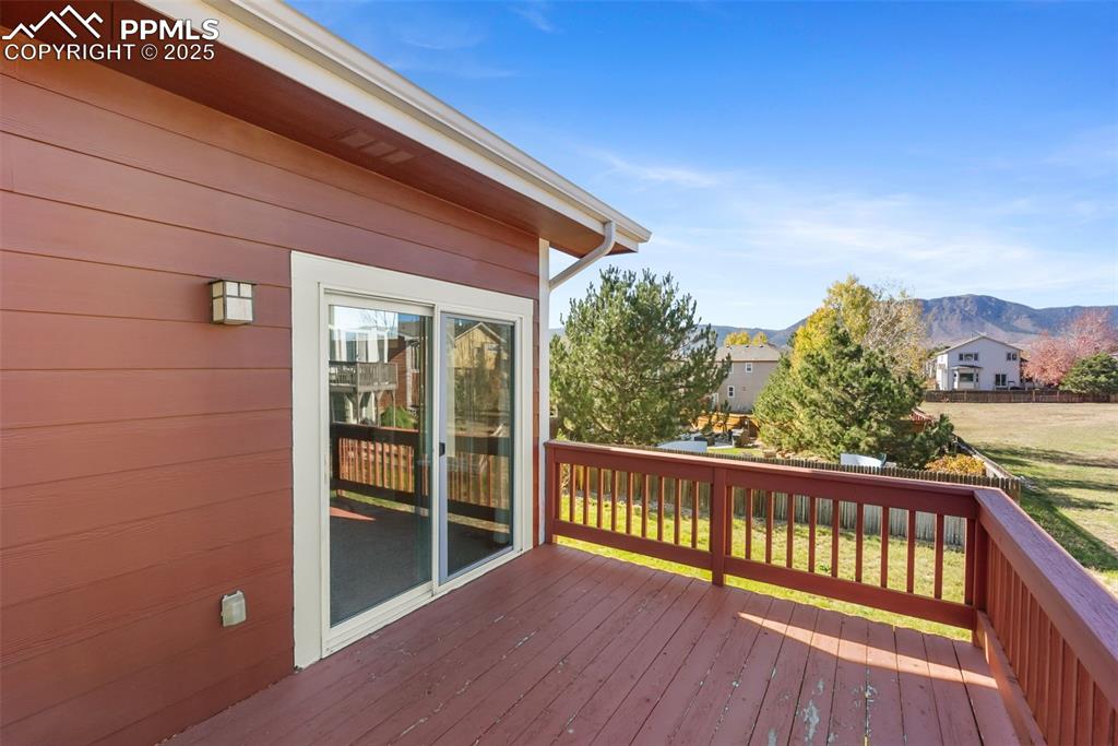 Image 38 of 50: Wooden deck featuring a mountain view