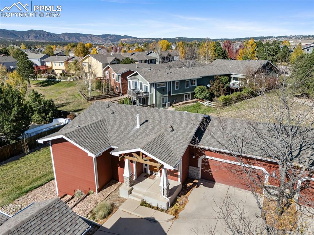 Image 48 of 50: Aerial view of residential area with mountains