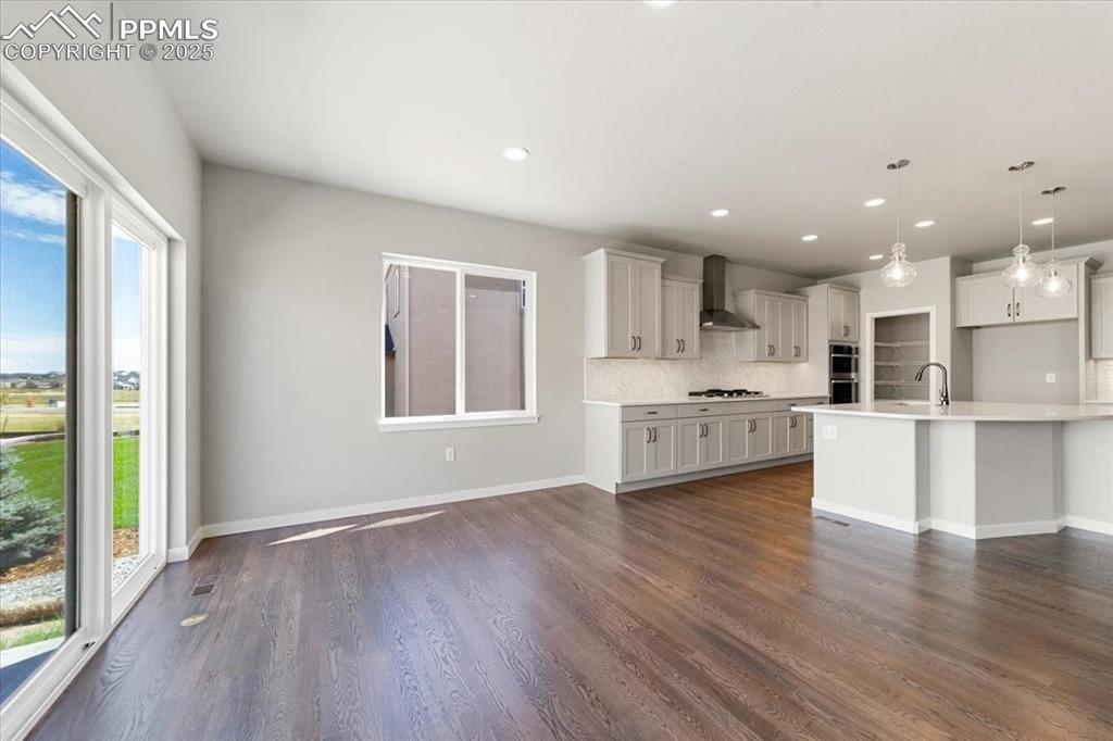 Image 10 of 37: Kitchen and Dining area