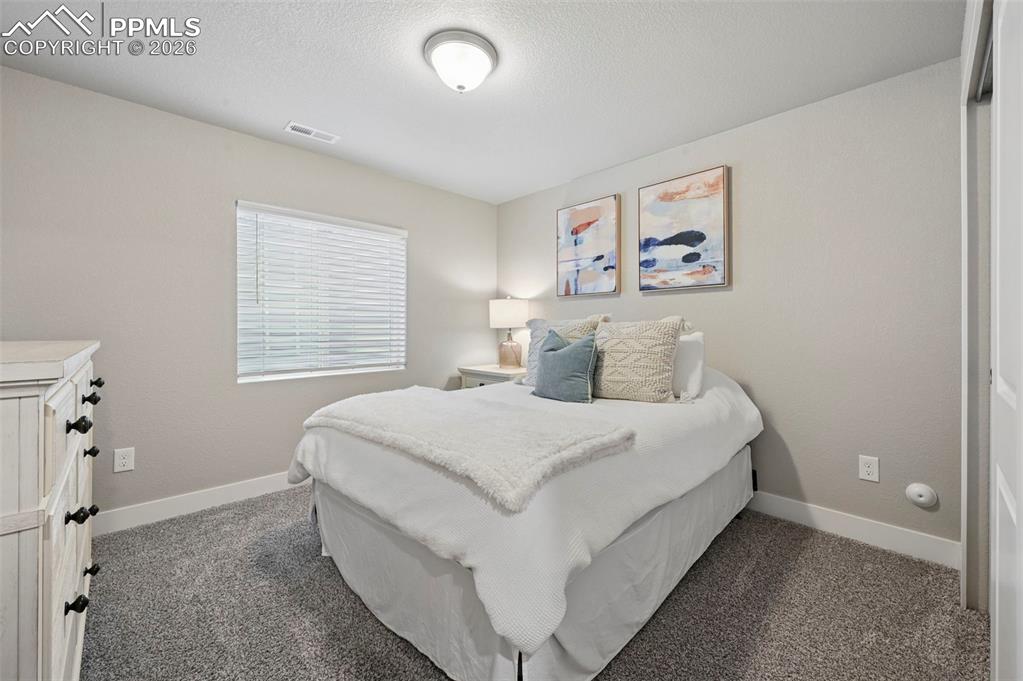 Image 32 of 42: basement bedroom