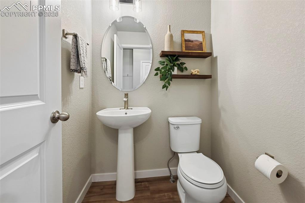 Image 7 of 42: main level powder room