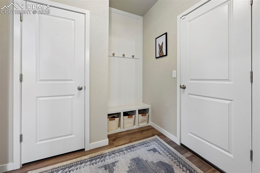 Image 8 of 42: step in from the garage to an organized space