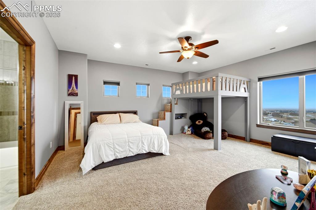 Image 29 of 48: Carpeted bedroom featuring a ceiling fan and recessed lighting
