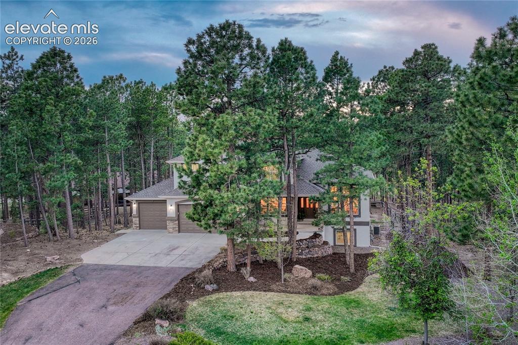 Image 1 of 49: Beautifully wooded 2/3-acre lot in the highly desirable Walden community.
