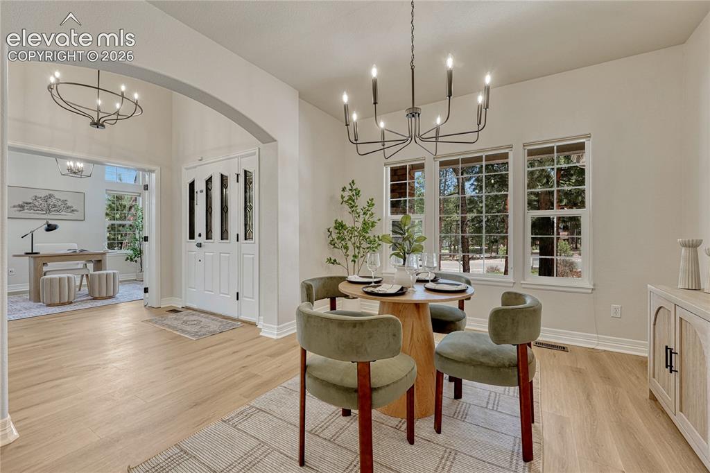 Image 11 of 49: Lovely dining room...where forest views continue.