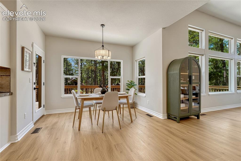 Image 16 of 49: Eat-in kitchen with walk-out access...