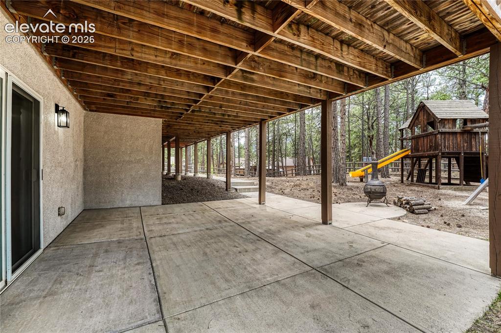 Image 39 of 49: ...large, covered, concrete patio.