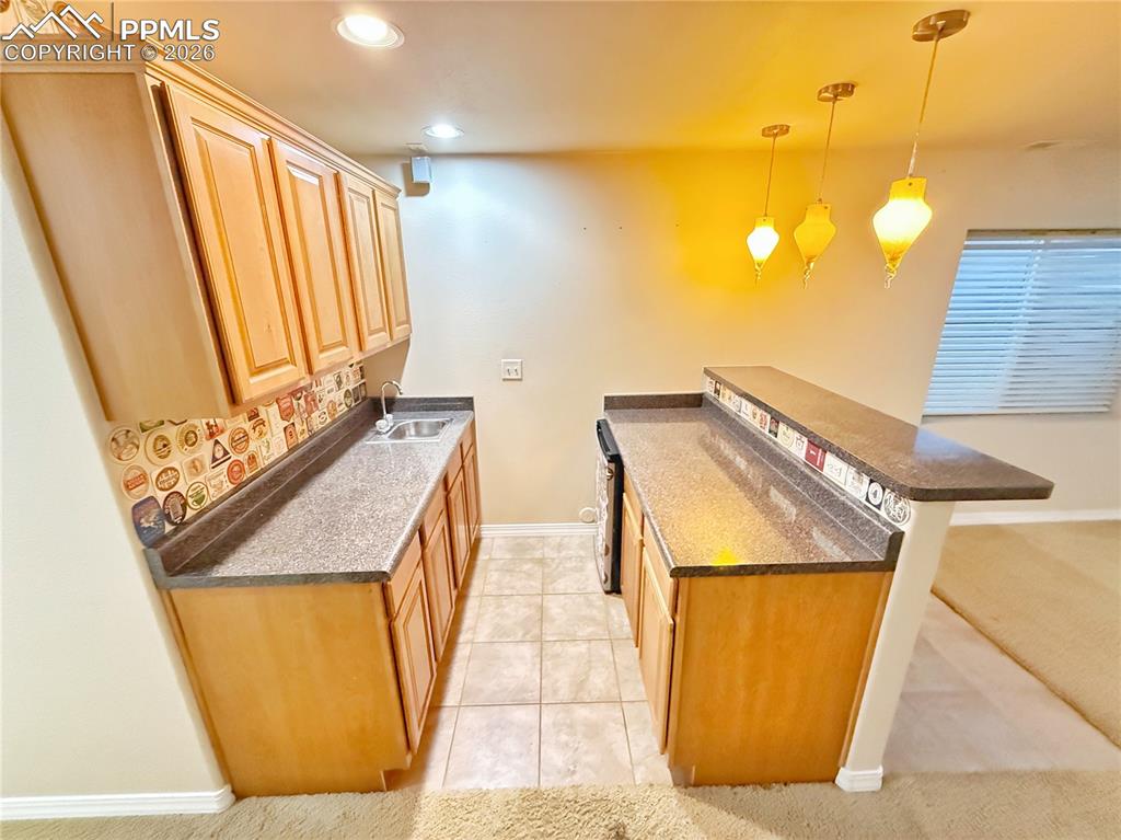 Image 21 of 28: Basement wet bar