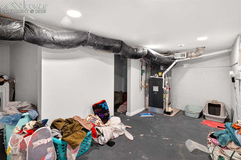 Image 15 of 20: Finished basement with heating unit