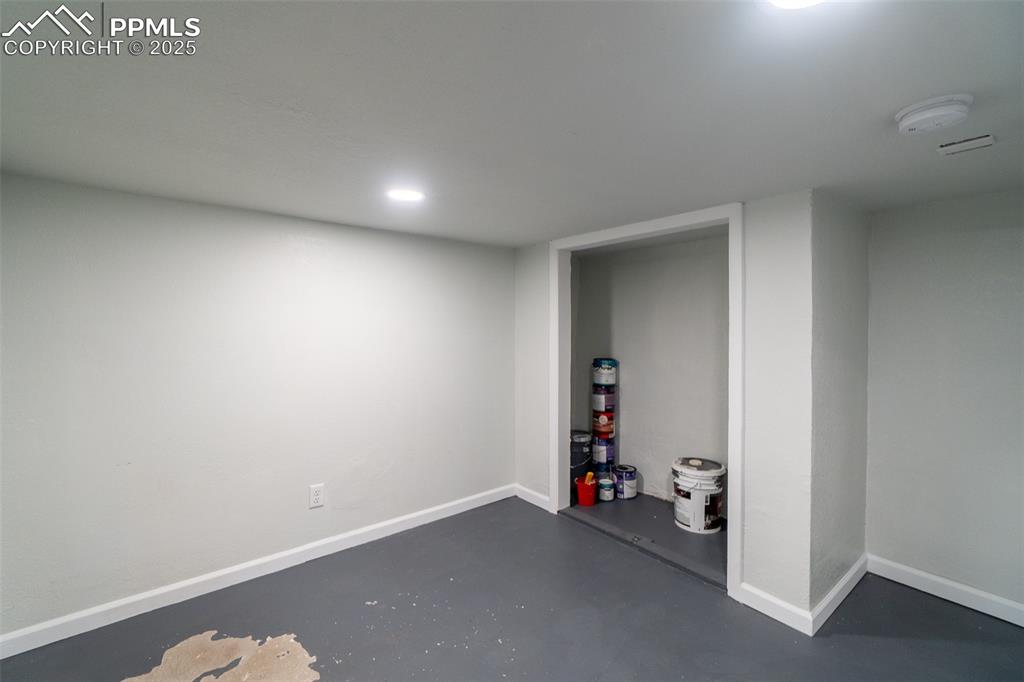 Image 21 of 29: Below grade area with baseboards