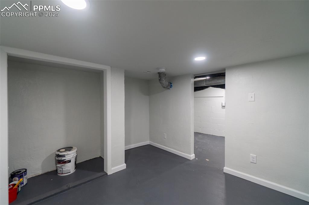 Image 23 of 29: Finished basement featuring baseboards