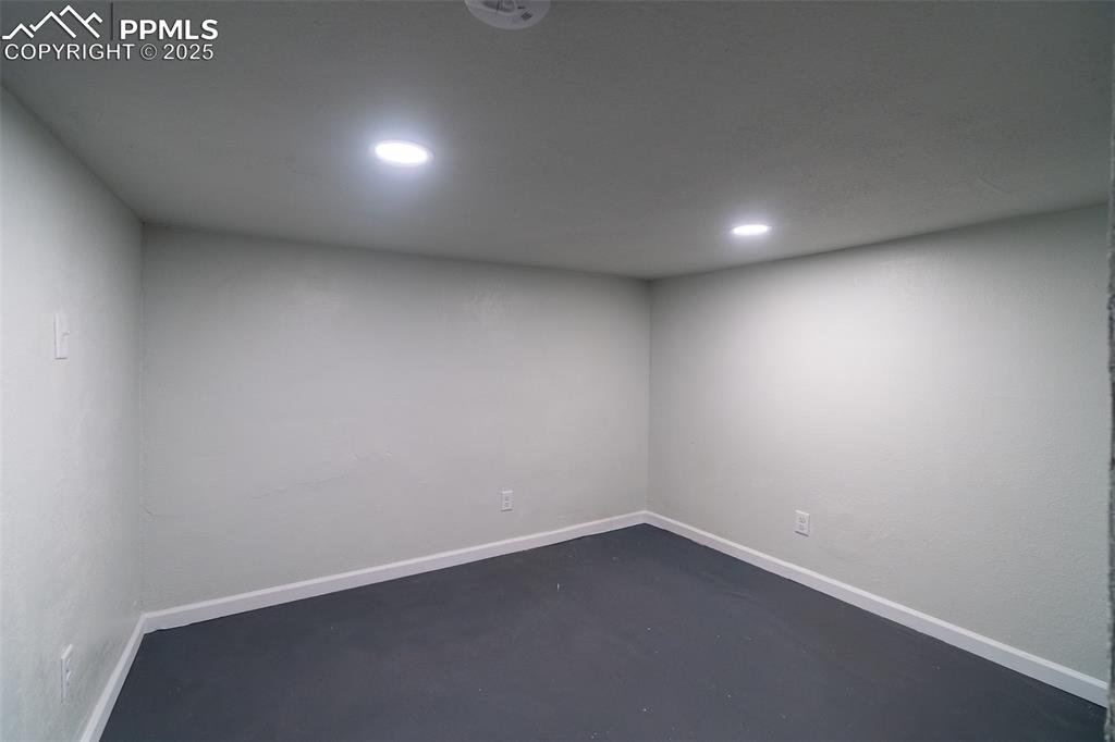 Image 24 of 29: Below grade area with baseboards and recessed lighting
