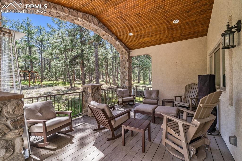 Image 3 of 46: The back deck is the perfect place for most seasons.