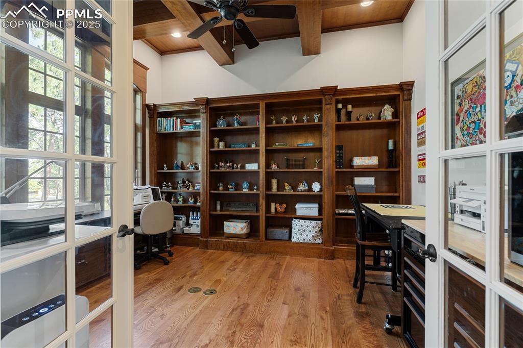 Image 6 of 46: Just off the main foyer, this office is stunning with built ins.