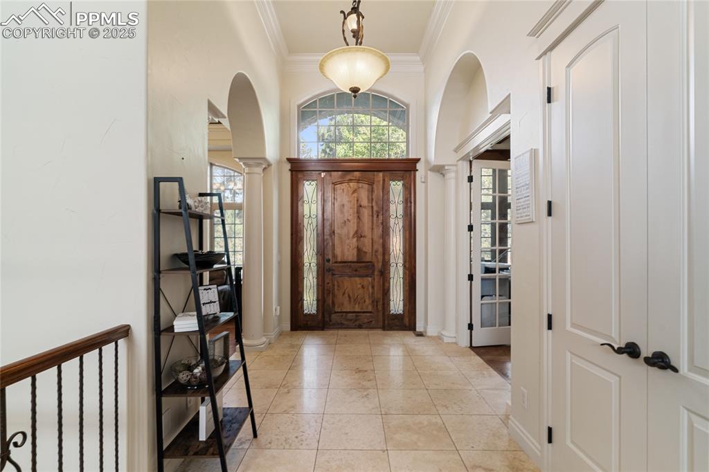 Image 7 of 46: Adjacent is a dining room with soaring ceilings and lots of light.