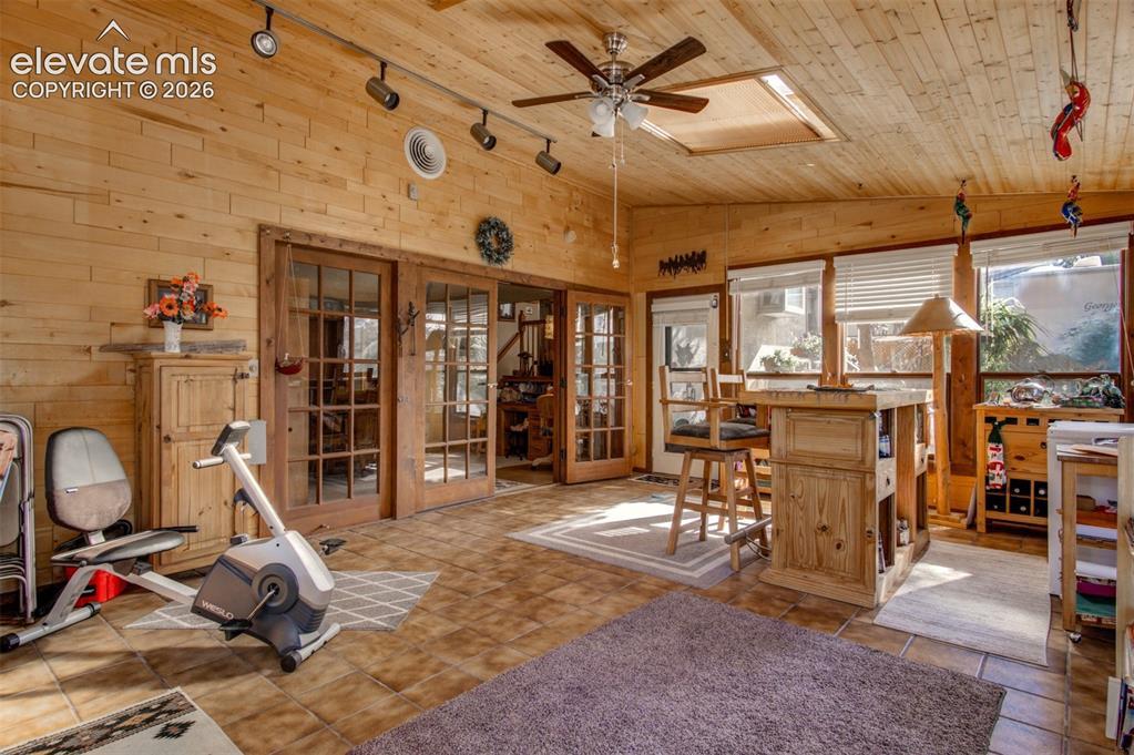 Image 15 of 45: Sun Room has electric baseboard heat for year round comfort.
