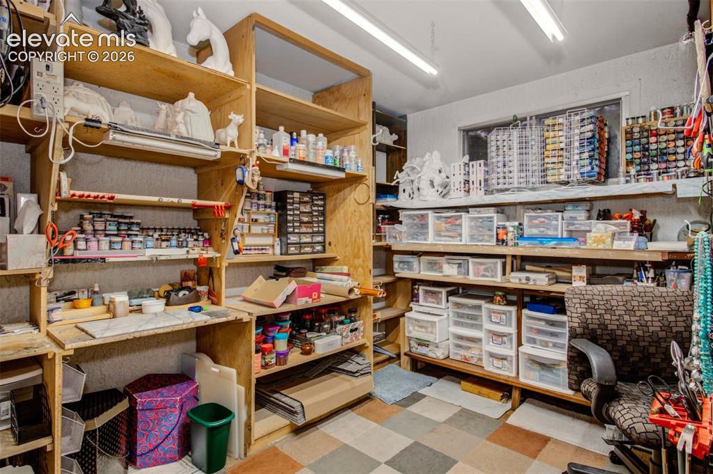 Image 27 of 45: This is being used as a craft/hobby area with Shelving for all your supplie