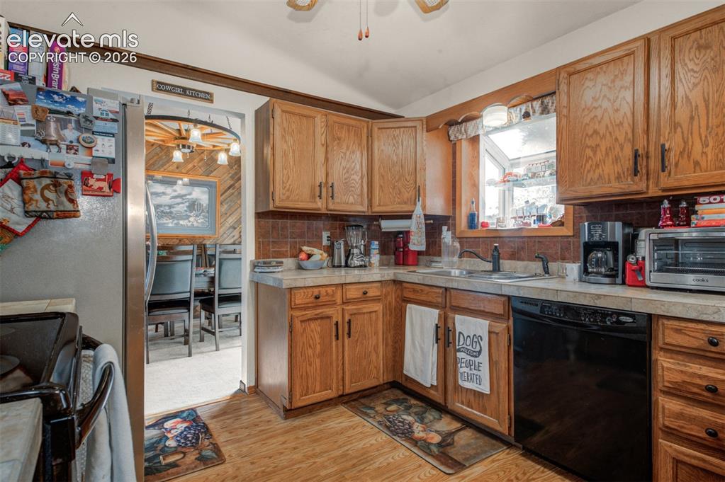 Image 4 of 45: Task-orientated Kitchen featuring  sink with a west facing window above the