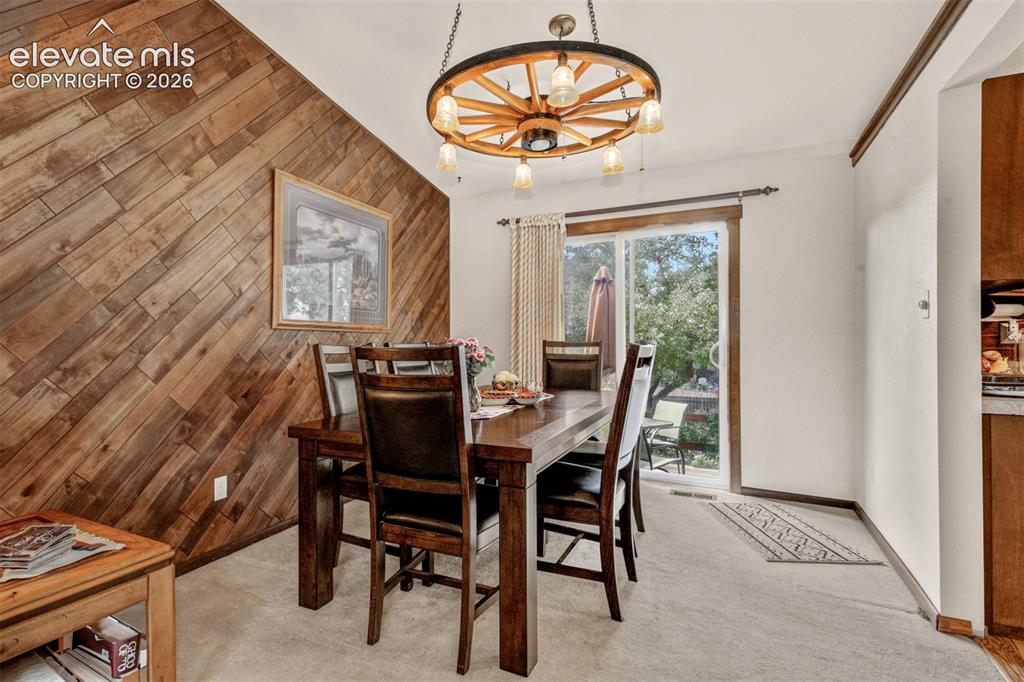 Image 9 of 45: Spacious dining for family and friend with walkout to deck and rear yard.