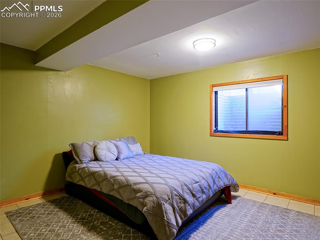 Image 29 of 36: Basement Bedroom