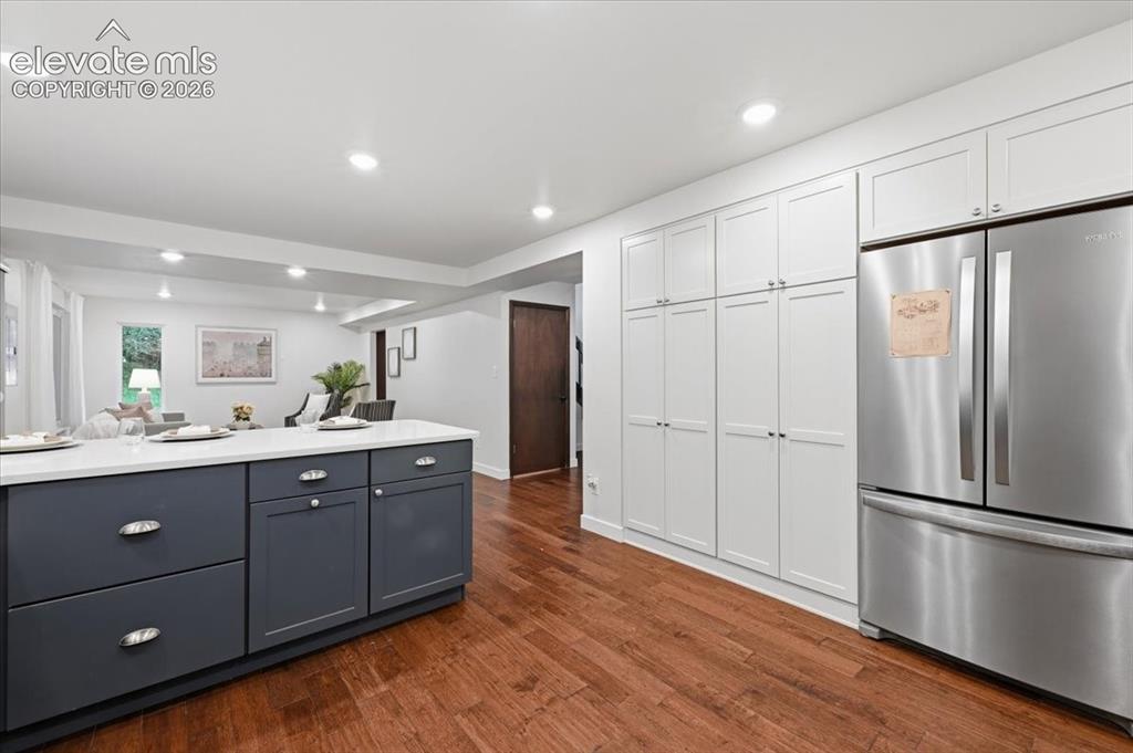 Image 18 of 50: Contemporary kitchen featuring stainless steel French-door refrigerator, an